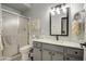 Modern bathroom featuring a new sink, mirror, vanity lighting and a tiled shower at 1021 S Greenfield Rd # 1178, Mesa, AZ 85206