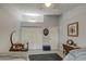 Bright bedroom with two twin beds, a ceiling fan, and a triple door closet at 1021 S Greenfield Rd # 1178, Mesa, AZ 85206