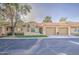 Lovely home with a well-manicured lawn, seating area, and two-car garage at 1021 S Greenfield Rd # 1178, Mesa, AZ 85206