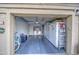 View of garage with multiple storage cabinets, laundry area and exterior access at 1021 S Greenfield Rd # 1178, Mesa, AZ 85206