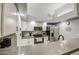 Modern kitchen features stainless steel appliances, white cabinets, and updated countertops at 1021 S Greenfield Rd # 1178, Mesa, AZ 85206