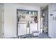 Functional laundry area with washer, dryer, and overhead storage at 1021 S Greenfield Rd # 1178, Mesa, AZ 85206