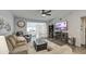Spacious living room featuring a ceiling fan, media center, and comfortable seating area at 1021 S Greenfield Rd # 1178, Mesa, AZ 85206