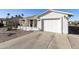 Exterior of a single-story home featuring an attached garage and driveway at 1106 S 82Nd Way, Mesa, AZ 85208