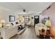 Cozy living room featuring hardwood floors, neutral paint, and comfortable seating at 1106 S 82Nd Way, Mesa, AZ 85208