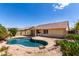 A sprawling backyard featuring a private pool and desert landscaping at 11318 S Hopi Dr, Goodyear, AZ 85338