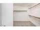 Walk-in closet with carpeted floor and shelving at 11318 S Hopi Dr, Goodyear, AZ 85338