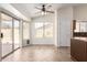 Cozy dining area with tile flooring, plenty of natural light, and a sliding glass door at 11318 S Hopi Dr, Goodyear, AZ 85338
