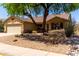 Beautiful single-story home with a two-car garage and low-water desert landscaping at 11318 S Hopi Dr, Goodyear, AZ 85338