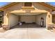 Empty garage with water filtration system and door to the house at 11318 S Hopi Dr, Goodyear, AZ 85338