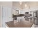 Kitchen with granite countertops, stainless steel appliances, and white cabinets at 11318 S Hopi Dr, Goodyear, AZ 85338