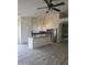 Bright kitchen featuring a center island, stainless steel appliances, and modern lighting fixtures at 11318 S Hopi Dr, Goodyear, AZ 85338