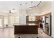 Spacious kitchen featuring an island, modern appliances, and stylish pendant lighting at 11318 S Hopi Dr, Goodyear, AZ 85338