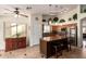 Bright kitchen featuring granite countertops, stainless appliances, an island and tiled floors at 11318 S Hopi Dr, Goodyear, AZ 85338