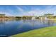 Scenic view of lake with fountains and a clear sky, perfect for relaxation at 11318 S Hopi Dr, Goodyear, AZ 85338