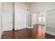 Bright, airy living room featuring hardwood floors, double doors, and high ceilings at 11318 S Hopi Dr, Goodyear, AZ 85338