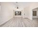 Inviting living room with stylish floors, neutral paint, and a view to the front yard at 11318 S Hopi Dr, Goodyear, AZ 85338