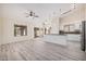 This living room area flows into the modern kitchen and has lots of natural light at 11318 S Hopi Dr, Goodyear, AZ 85338