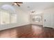 Spacious living room with hardwood floors, ceiling fan, and lots of natural light at 11318 S Hopi Dr, Goodyear, AZ 85338