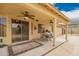 Inviting covered patio with ceiling fans, dining area, and seamless indoor-outdoor flow at 11318 S Hopi Dr, Goodyear, AZ 85338