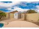 Backyard featuring a shed with desert landscaping and an enclosed fence at 11318 S Hopi Dr, Goodyear, AZ 85338