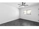 This bedroom features a ceiling fan and sleek tiled flooring for a modern touch at 11359 E Elena Ave, Mesa, AZ 85208