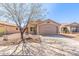 Charming single-story home with desert landscaping and a two-car garage at 11359 E Elena Ave, Mesa, AZ 85208