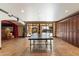 Finished basement with large sliding glass doors opening to the pool and backyard area at 11988 E Larkspur Dr, Scottsdale, AZ 85259
