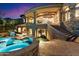 Luxury home exterior with covered patio, pool, spa, and staircase to an upper deck at 11988 E Larkspur Dr, Scottsdale, AZ 85259