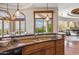Gourmet kitchen features granite countertops, modern fixtures, stainless appliances, and natural light at 11988 E Larkspur Dr, Scottsdale, AZ 85259