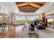Open-concept living room with beamed ceiling, fireplace, built-ins, and expansive mountain views at 11988 E Larkspur Dr, Scottsdale, AZ 85259