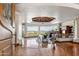 Inviting living room featuring a beamed ceiling, fireplace, built-ins, and stunning mountain views at 11988 E Larkspur Dr, Scottsdale, AZ 85259