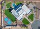Bird's eye view of elegant home, basketball court, pool, and manicured landscaping at 12034 N 61St St, Scottsdale, AZ 85254