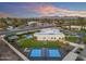 An aerial view reveals a basketball court and pool, enhancing this home's appeal at 12034 N 61St St, Scottsdale, AZ 85254