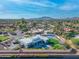 Aerial view of an elegant house with pool, green lawns, and privacy fence at 12034 N 61St St, Scottsdale, AZ 85254