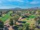 Scenic aerial shot of an expansive golf course surrounded by trees and homes at 12034 N 61St St, Scottsdale, AZ 85254