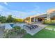 Inviting backyard featuring pool, patio, lounge chairs, and manicured lawn at 12034 N 61St St, Scottsdale, AZ 85254