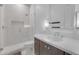 Modern bathroom with a marble shower, sleek vanity, and recessed lighting, providing a luxurious experience at 12034 N 61St St, Scottsdale, AZ 85254