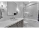 Bathroom with a shower-tub combo, modern vanity, and stylish lighting, offering a functional design at 12034 N 61St St, Scottsdale, AZ 85254
