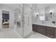 Modern bathroom featuring a glass shower, sleek vanity, and stylish sconces for a luxurious feel at 12034 N 61St St, Scottsdale, AZ 85254