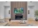 Close-up of a modern fireplace with TV, featuring elegant decor and stylish finishes at 12034 N 61St St, Scottsdale, AZ 85254