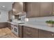Detailed view of kitchen with high-end stainless steel appliances, countertops, and wood cabinetry at 12034 N 61St St, Scottsdale, AZ 85254