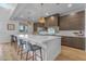Bright kitchen boasts a large island with seating and modern stainless steel appliances at 12034 N 61St St, Scottsdale, AZ 85254