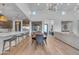 Open-concept living area with modern lighting, soaring ceilings, and hardwood floors at 12034 N 61St St, Scottsdale, AZ 85254