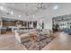 Open-concept living room with high ceilings, modern lighting, and a seamless flow to the kitchen at 12034 N 61St St, Scottsdale, AZ 85254