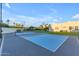 Backyard featuring a versatile sport court with basketball hoop and tennis net at 12034 N 61St St, Scottsdale, AZ 85254