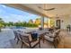 Inviting covered patio with stylish furniture, ceiling fans, and outdoor grill, perfect for entertaining and relaxation at 12034 N 61St St, Scottsdale, AZ 85254