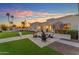 Inviting backyard patio with fire pit and comfortable seating, perfect for outdoor entertaining at 12034 N 61St St, Scottsdale, AZ 85254