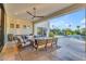 Elegant outdoor patio with lounge area, modern decor, and pool view, ideal for relaxation and outdoor enjoyment at 12034 N 61St St, Scottsdale, AZ 85254