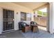 Cozy covered patio with seating and a decorative rug at 14212 W Weldon Ave, Goodyear, AZ 85395